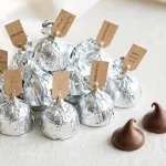 Calories in a Hershey Kiss - foil wrapped chocolate kisses with two unwrapped milk chocolate drops